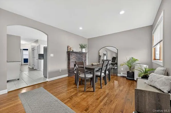 a dining room with furniture and wooden floor