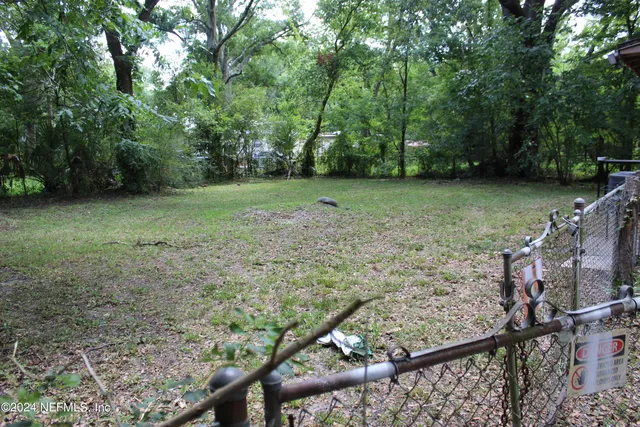 a backyard of a house with lots of green space