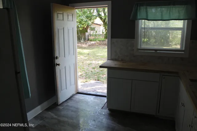 a kitchen with a sink and a window