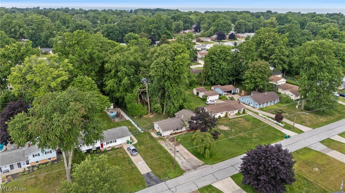 6472 Southgrove Road Mentor, OH 44060 - Photo 4 of 37 Aerial perspective of a residential street with mature tree canopies