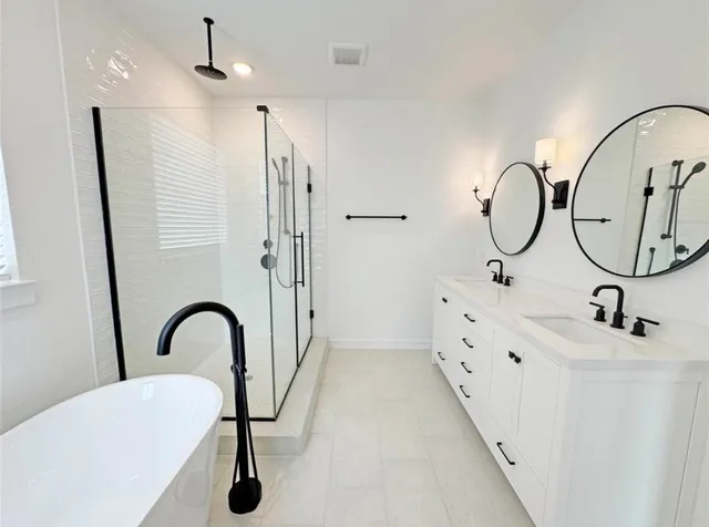 a bathroom with a sink and mirror