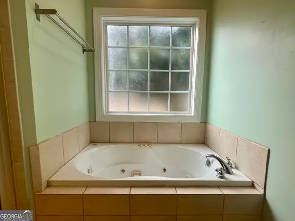 a bathroom with a bath tub