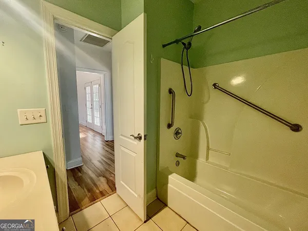 a bathroom with a glass shower door