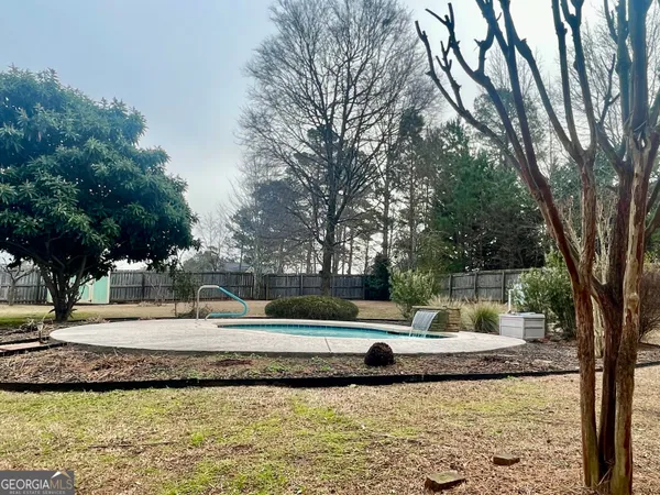 a view of a swimming pool with a patio