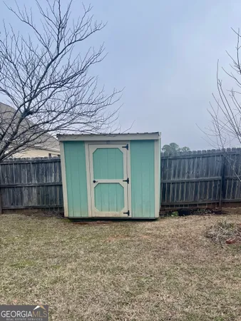 a front view of a house with plants