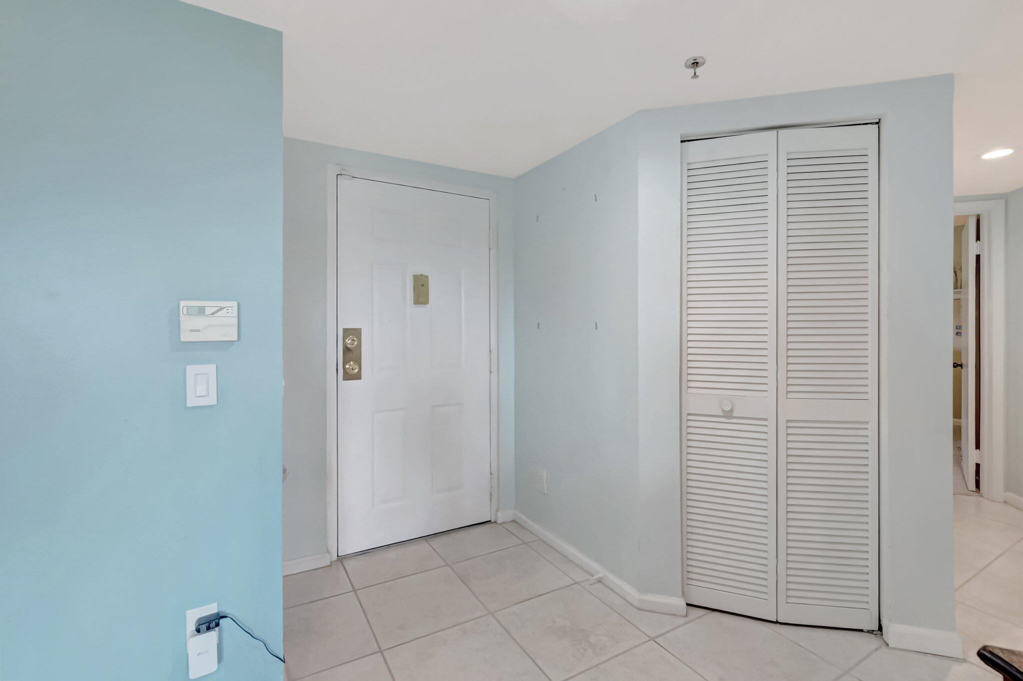 7507 La Paz Boulevard, Unit 202 Boca Raton, FL 33433 - Photo 3 of 31 foyer