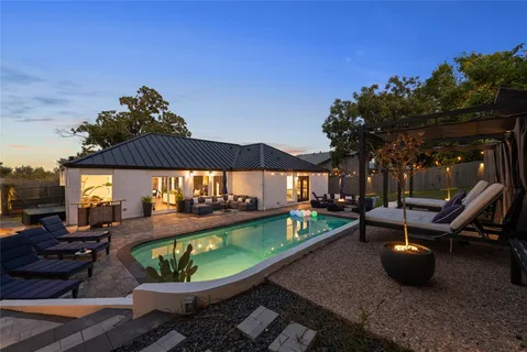 a view of a swimming pool with a patio