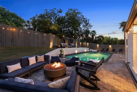 a view of a patio with couple of chairs