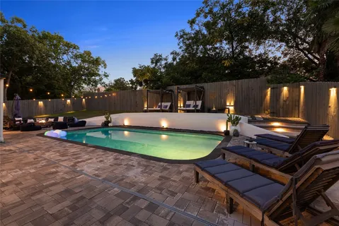 a view of a swimming pool with a patio