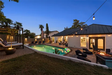 a view of a swimming pool with a patio