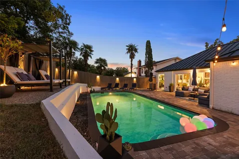 a view of a swimming pool with a patio