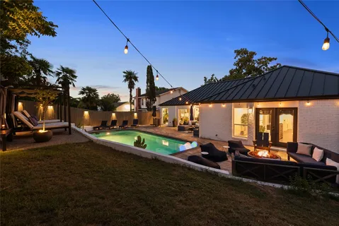 a view of a swimming pool with a patio