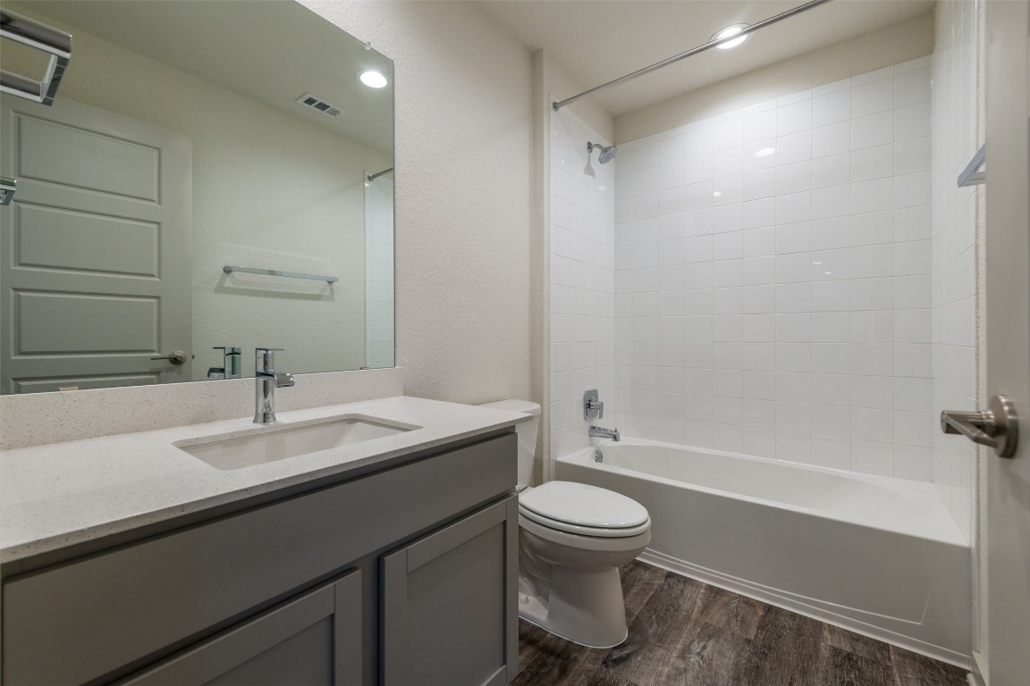 289 Deserti Road Leander, TX 78641 - Photo 16 of 19 a bathroom with a sink toilet and shower