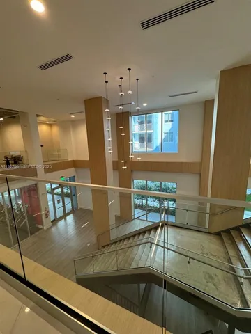 a view of a gym room with gym equipment