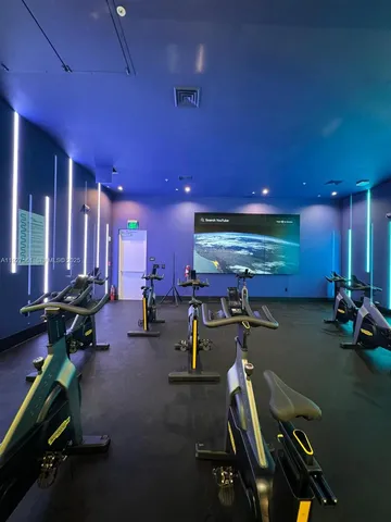 wooden floor with a view of living room