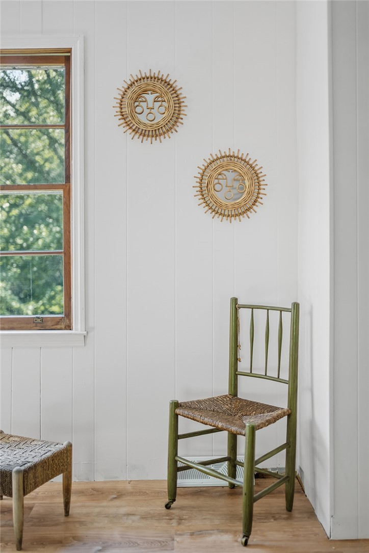 209 Cleveland Pike Road Westminster, SC 29693 - Photo 14 of 30 Well-lit room with wood paneling and views of mature trees from the window.