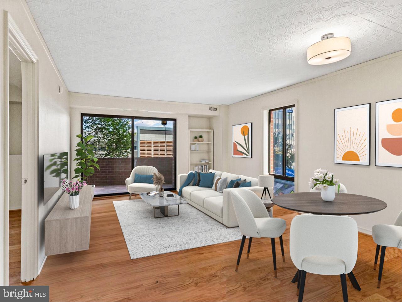 2320 Wisconsin Avenue Northwest, Unit 206 Washington, DC 20007 - Photo 2 of 32 a living room with furniture large window and a table