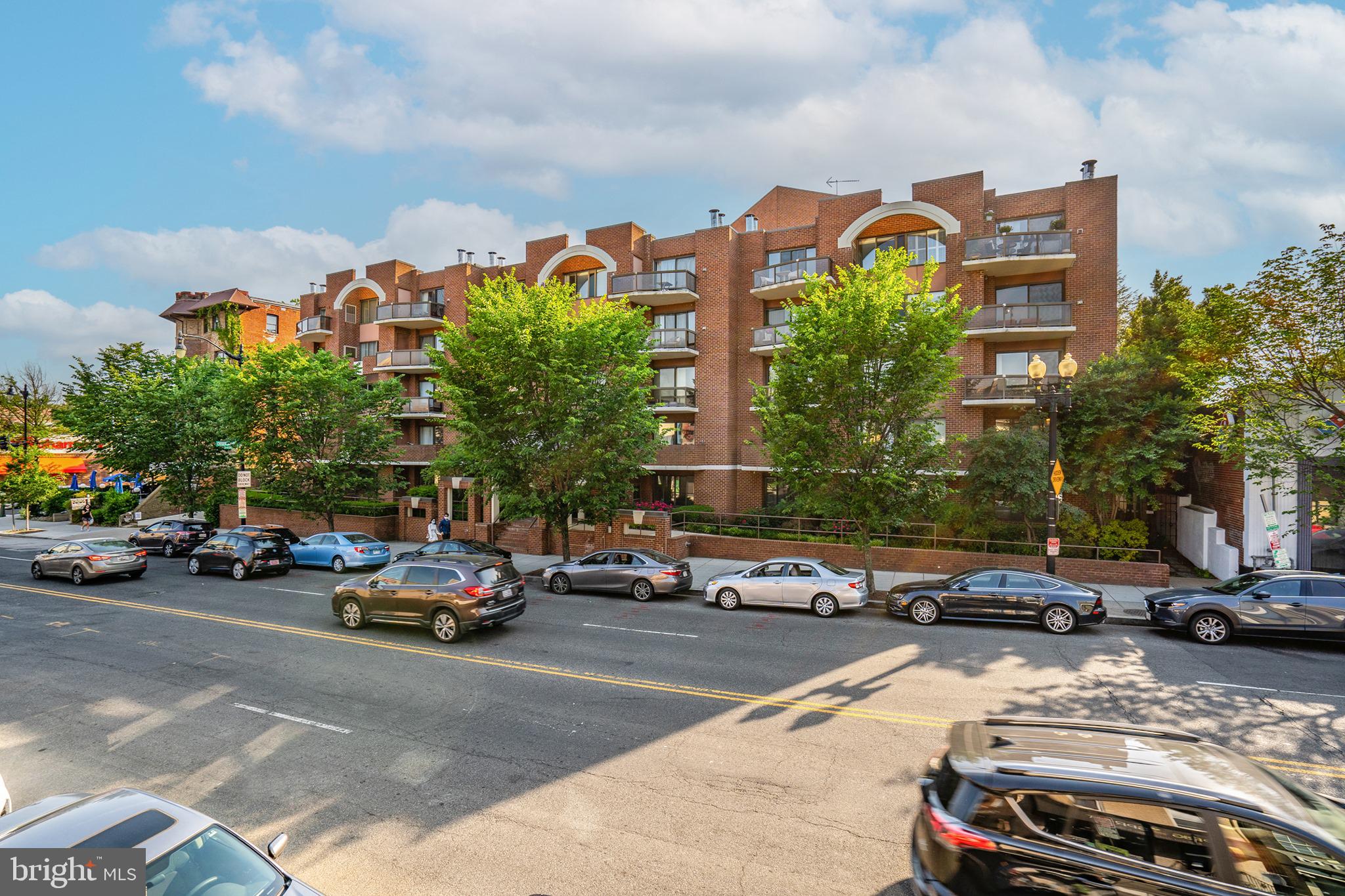 2320 Wisconsin Avenue Northwest, Unit 206 Washington, DC 20007 - Photo 23 of 32 a cars parked in front of a building