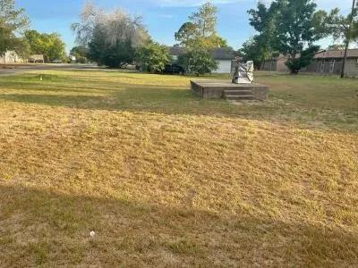 a view of a lake with a yard