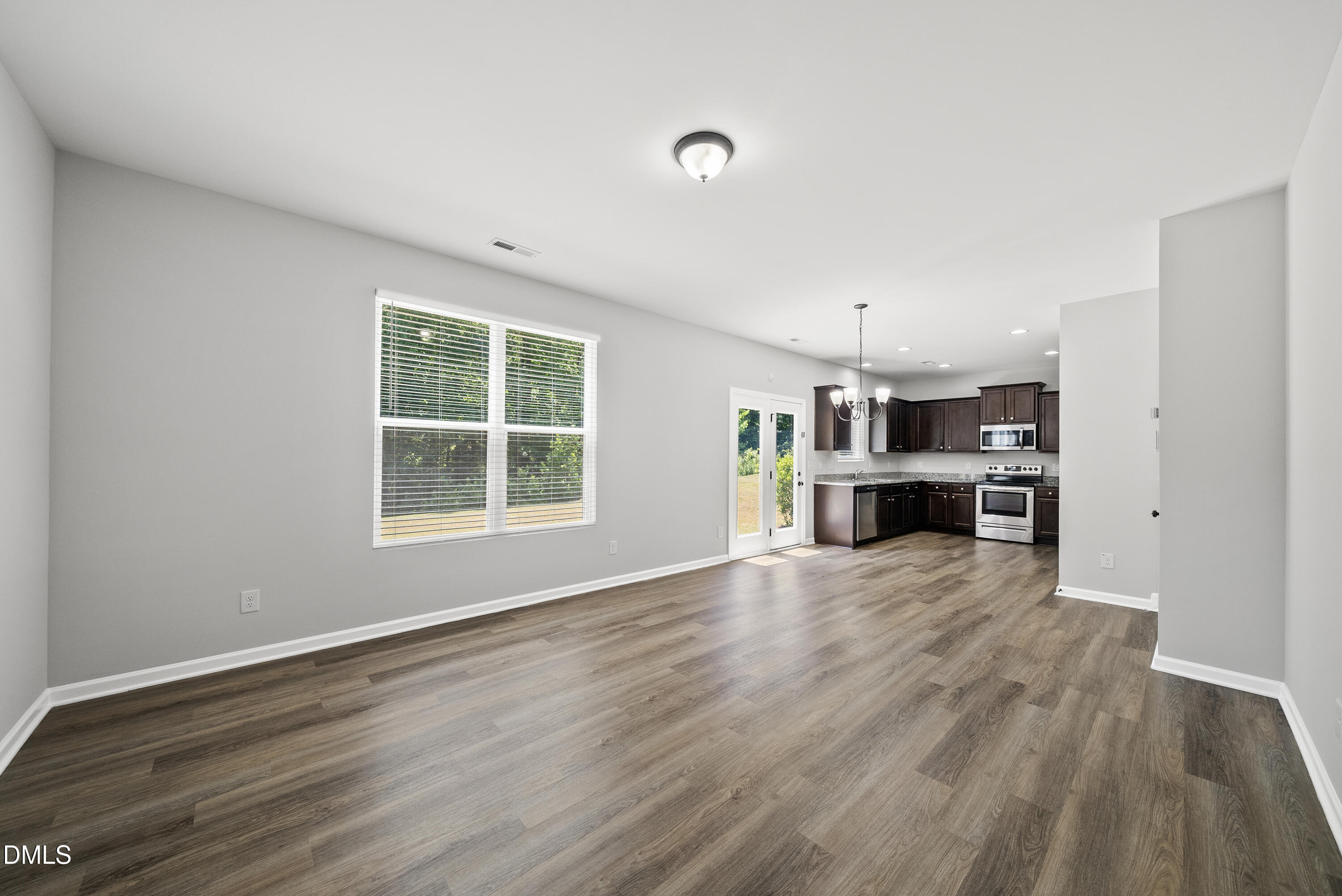 2816 Elsa Drive Raleigh, NC 27610 - Photo 11 of 35 a view of kitchen with furniture and wooden floor