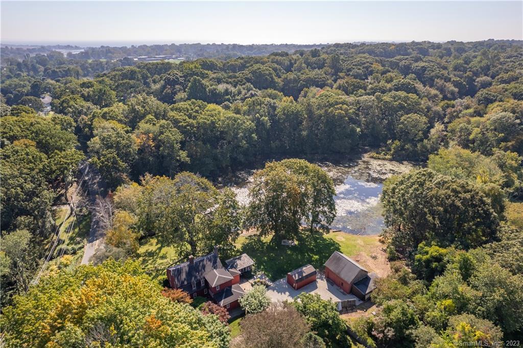 an aerial view of a house with a yard