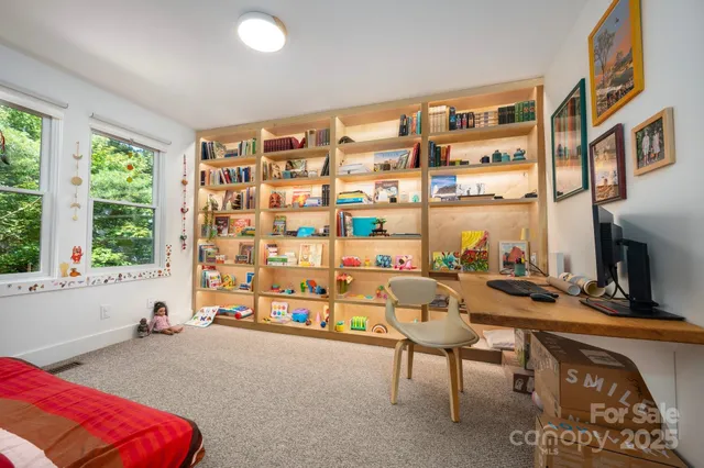 a view of a livingroom with furniture and a window
