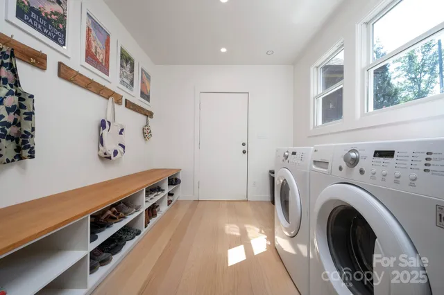 a view of a hallway with washer and dryer