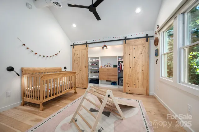 a bedroom with furniture and a window