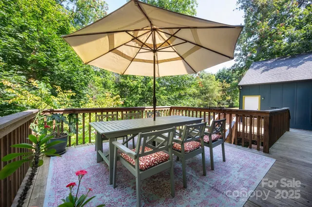 a view of a wooden deck with furniture
