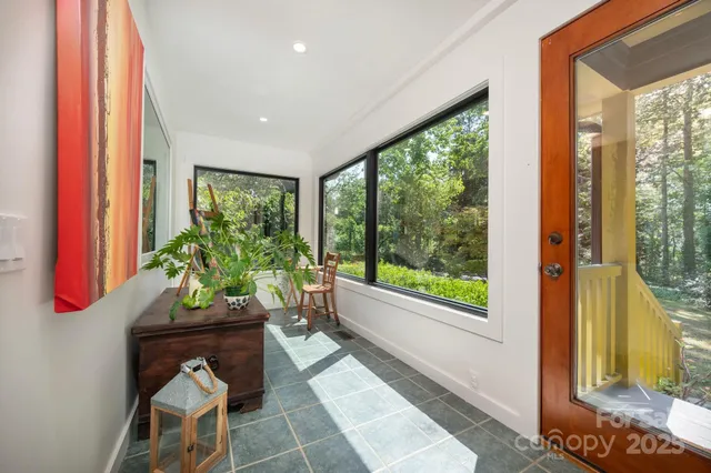 a living room filled with furniture and a window