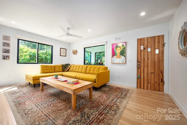 a living room with furniture and a rug