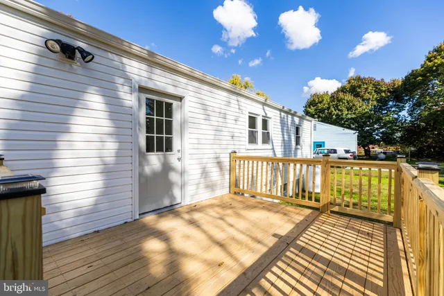 a view of a balcony with wooden floor