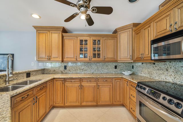 a bedroom with a bed and a tv on the dresser