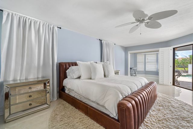 a spacious en suite bathroom with a double vanity sink and a mirror