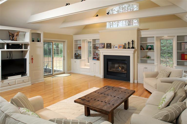 19 Ice Valley Road Osterville, MA 02655 - Photo 8 of 23 a living room with furniture a flat screen tv and a fireplace