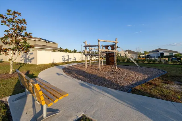 a view of a swimming pool with a lounge chair