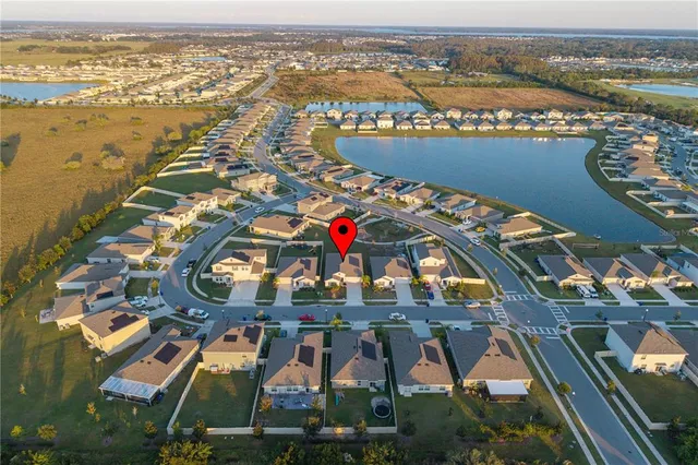 a view of a swimming pool with lawn chairs