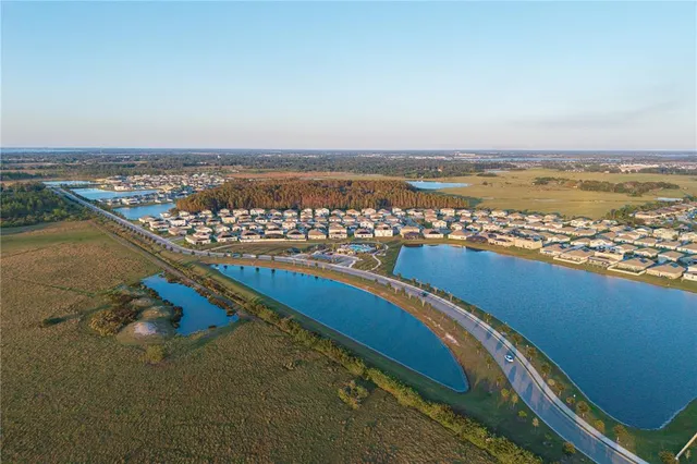 a patio with a table and chairs under an umbrella