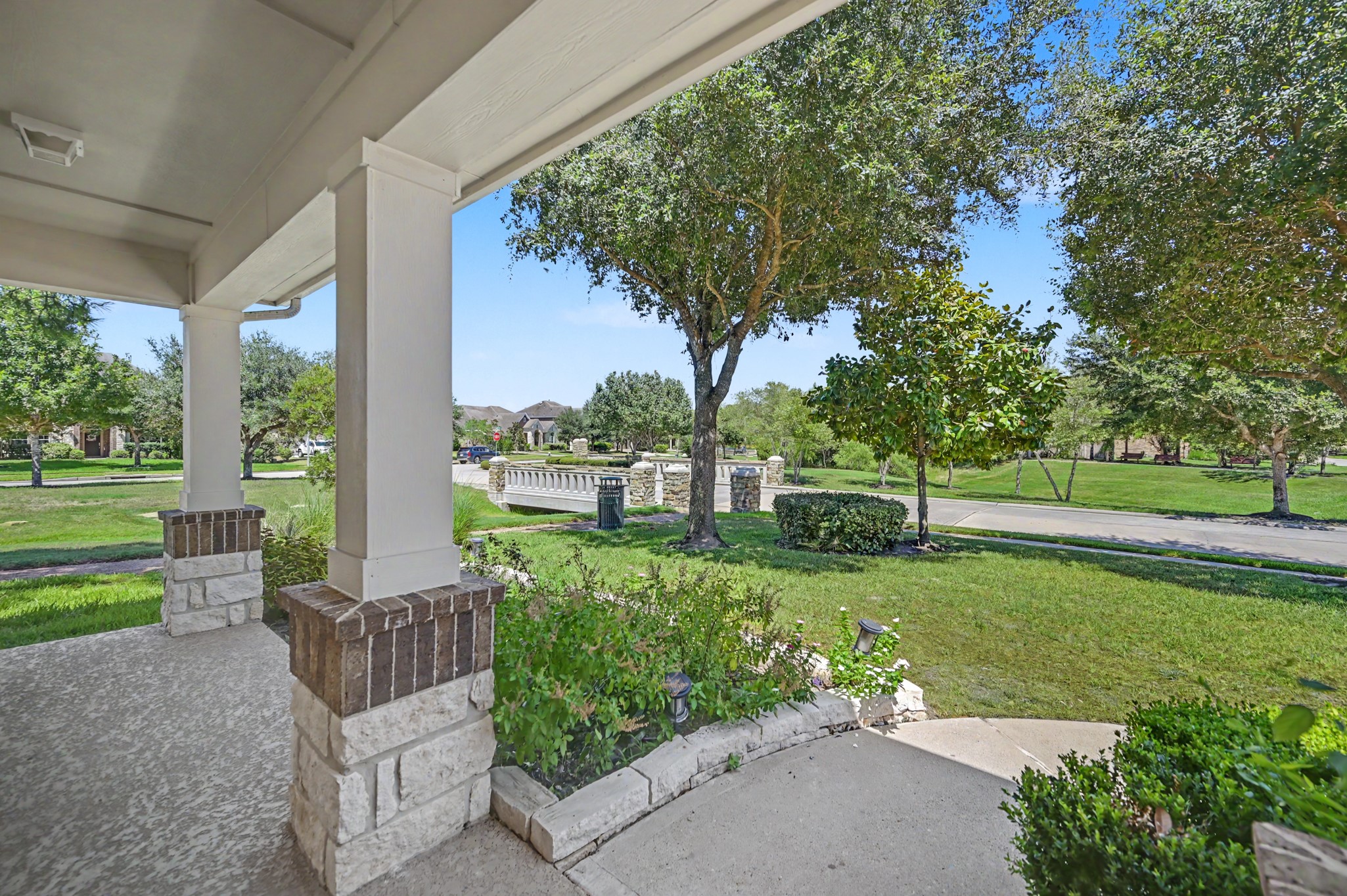 31325 Riley Woods Court Spring, TX 77386 - Photo 6 of 50 Enjoy a front porch view of the neighborhood park just across the street, adding green space and an inviting setting right outside your door.