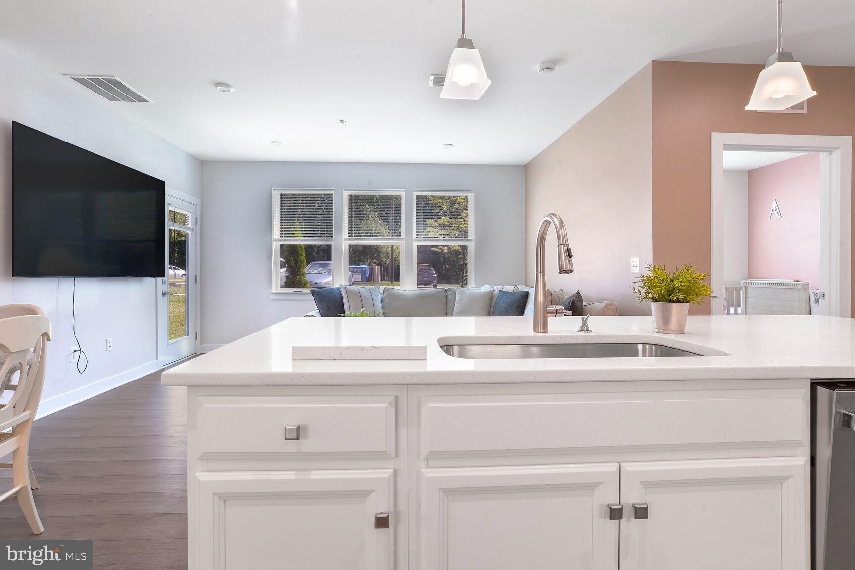 10401 Resort Road, Unit E Ellicott City, MD 21042 - Photo 16 of 44 a view of living room with furniture and a flat screen tv
