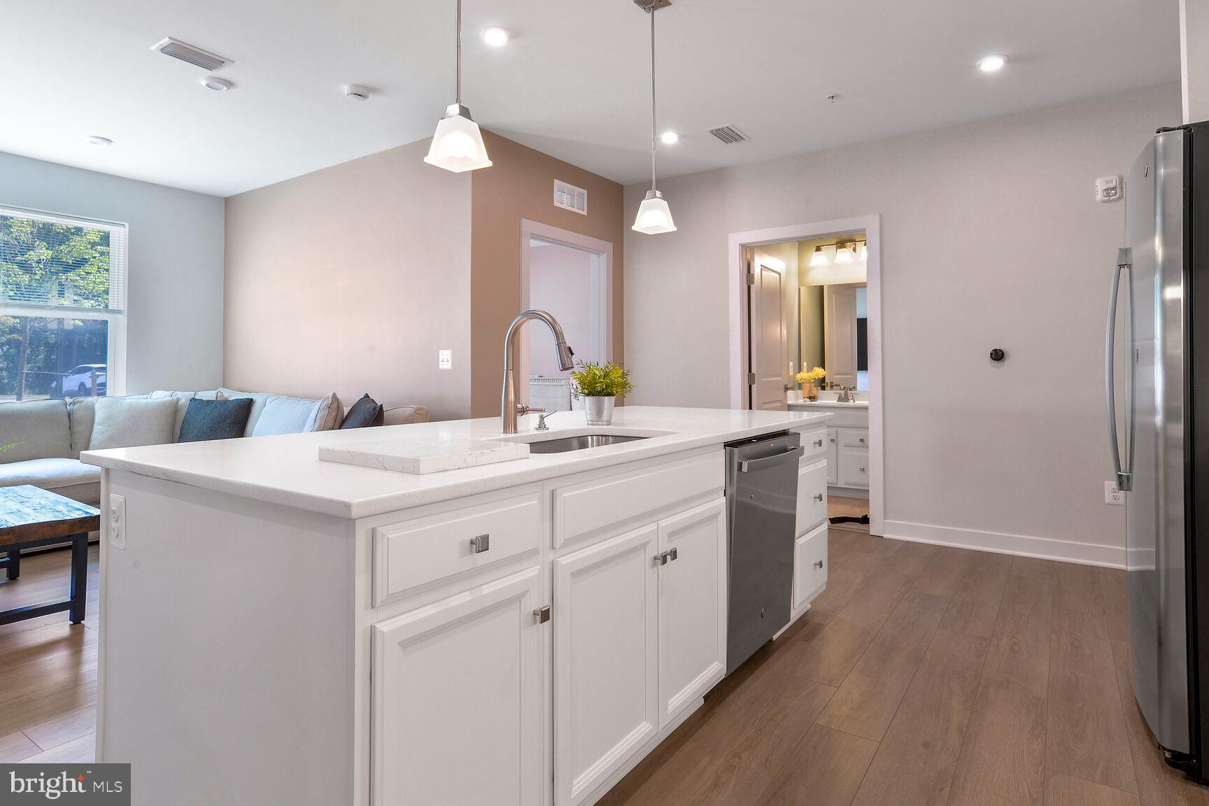 10401 Resort Road, Unit E Ellicott City, MD 21042 - Photo 17 of 44 a bathroom with a sink a vanity and a mirror