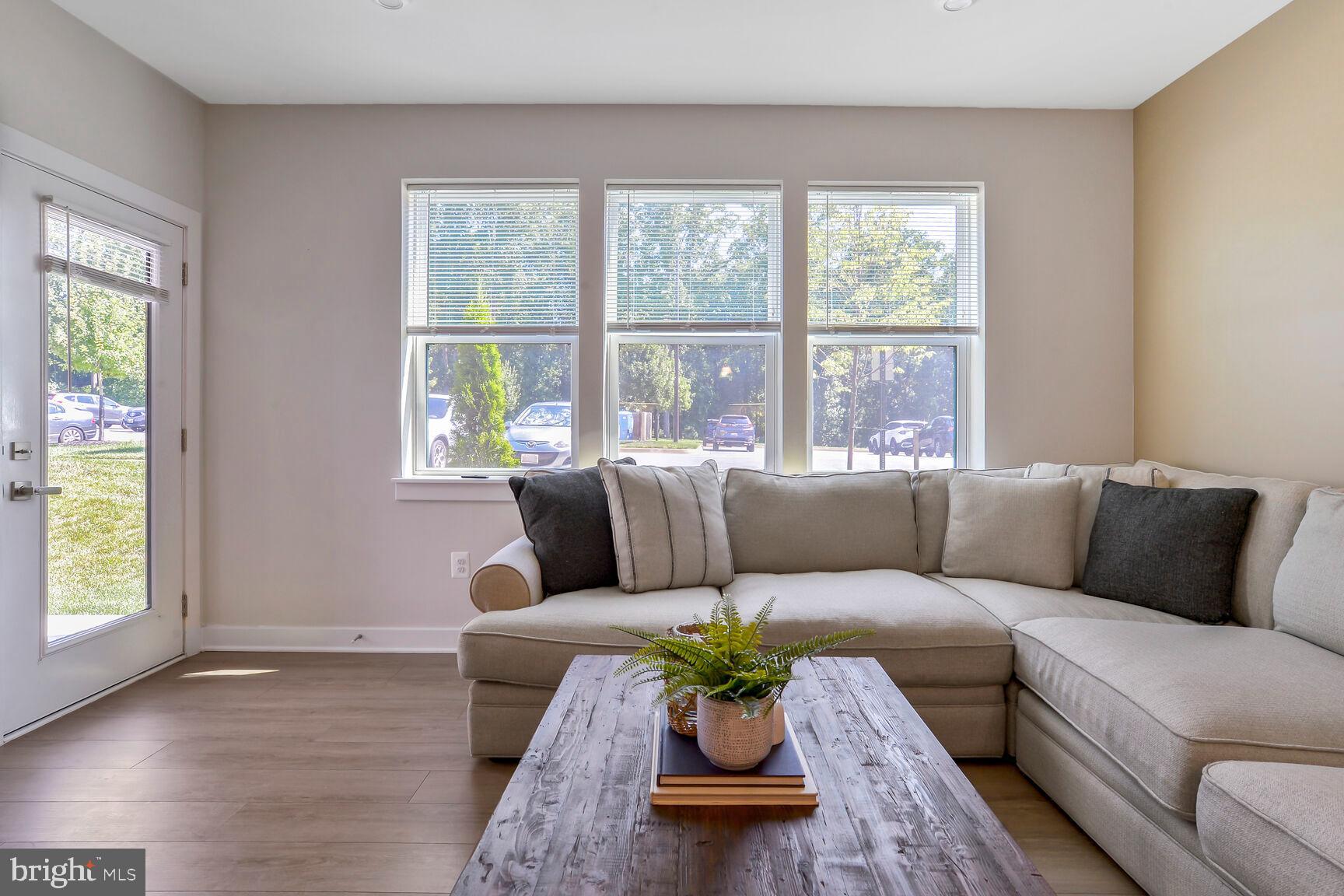 10401 Resort Road, Unit E Ellicott City, MD 21042 - Photo 22 of 44 a living room with furniture and a window