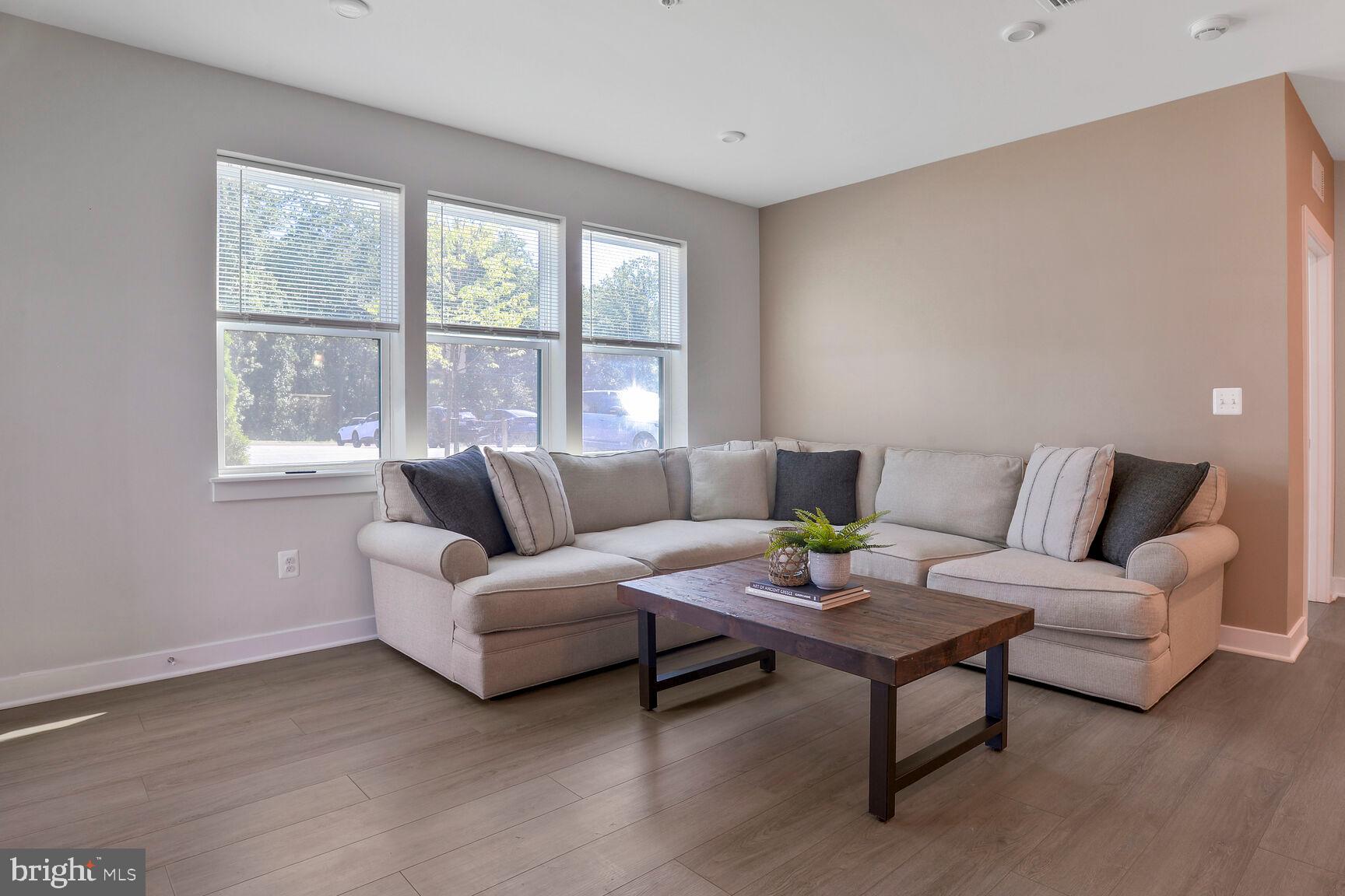 10401 Resort Road, Unit E Ellicott City, MD 21042 - Photo 25 of 44 a living room with furniture and a window