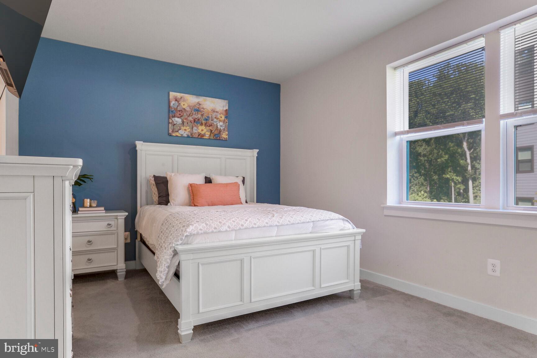 10401 Resort Road, Unit E Ellicott City, MD 21042 - Photo 28 of 44 a bedroom with a bed and a window