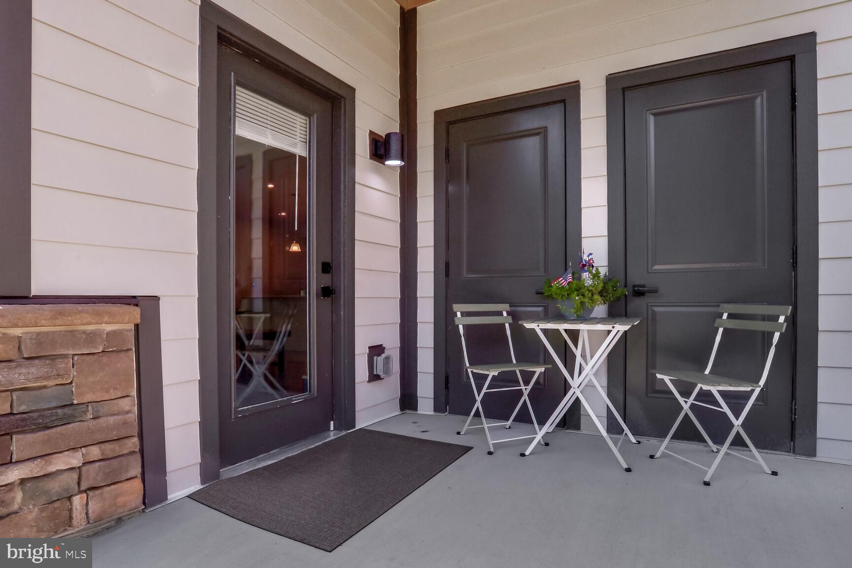 10401 Resort Road, Unit E Ellicott City, MD 21042 - Photo 39 of 44 a patio with table and chairs