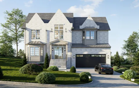 a front view of a house with a garden and parking
