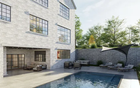 a view of a building with sitting area and furniture