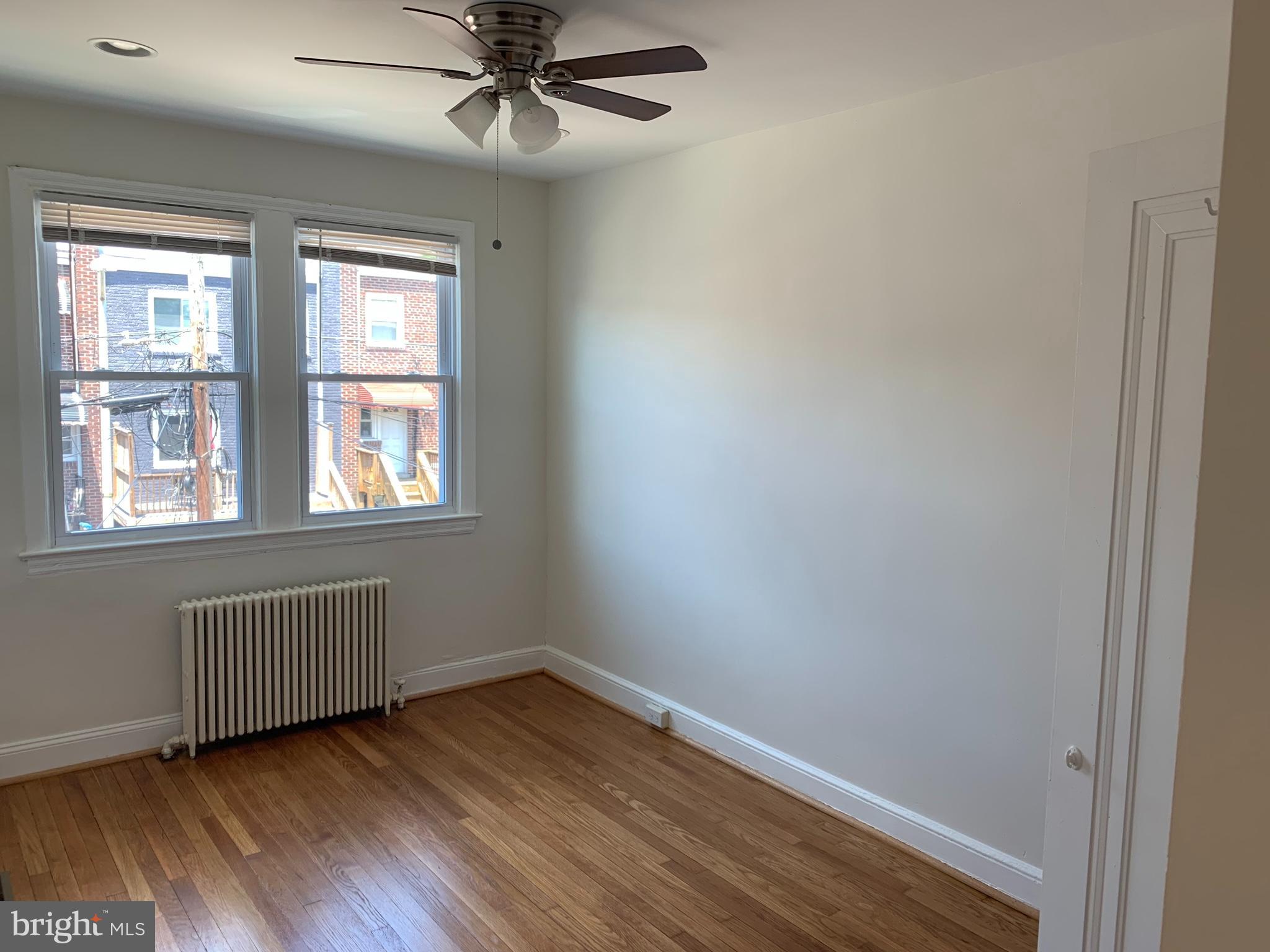 1326 Holbrook Street Northeast Washington, DC 20002 - Photo 14 of 21 a view of an empty room with wooden floor and a window