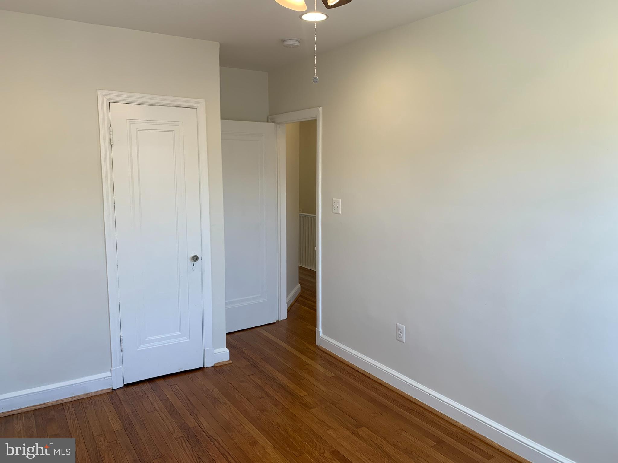 1326 Holbrook Street Northeast Washington, DC 20002 - Photo 15 of 21 a view of an empty room with wooden floor