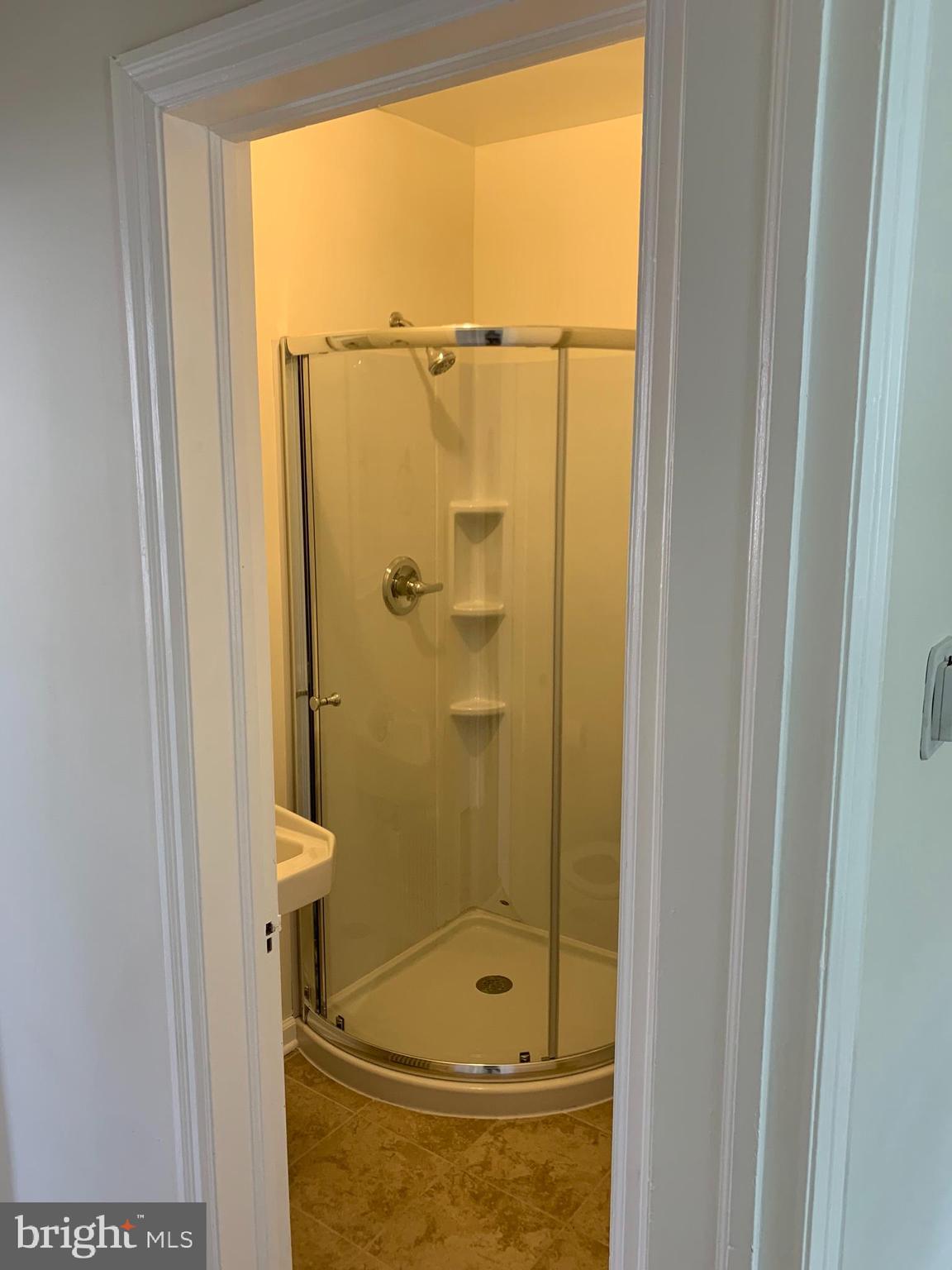 1326 Holbrook Street Northeast Washington, DC 20002 - Photo 8 of 21 a bathroom with a glass shower door